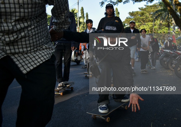 Skaters are taking part in the international world skateboarding day 'Go Skateboarding Day' with a ride around city streets in Malang City,...