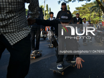 Skaters are taking part in the international world skateboarding day 'Go Skateboarding Day' with a ride around city streets in Malang City,...