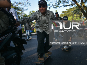 Skaters are taking part in the international world skateboarding day 'Go Skateboarding Day' with a ride around city streets in Malang City,...