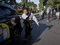 Skaters are taking part in the international world skateboarding day 'Go Skateboarding Day' with a ride around city streets in Malang City,...