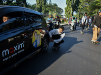 Skaters are taking part in the international world skateboarding day 'Go Skateboarding Day' with a ride around city streets in Malang City,...