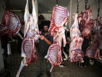 A Palestinian is displaying his wares in a market in Deir al-Balah in the central Gaza Strip, on June 21, 2024, as the conflict is continuin...