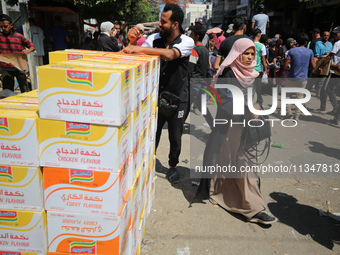 A Palestinian is displaying his wares in a market in Deir al-Balah in the central Gaza Strip, on June 21, 2024, as the conflict is continuin...