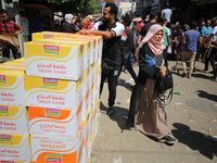 A Palestinian is displaying his wares in a market in Deir al-Balah in the central Gaza Strip, on June 21, 2024, as the conflict is continuin...