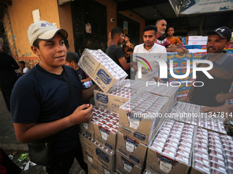 A Palestinian is displaying his wares in a market in Deir al-Balah in the central Gaza Strip, on June 21, 2024, as the conflict is continuin...