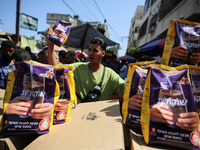 A Palestinian is displaying his wares in a market in Deir al-Balah in the central Gaza Strip, on June 21, 2024, as the conflict is continuin...