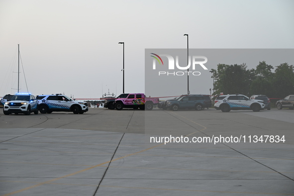 Chicago police are investigating the crime scene, which is leaving two people dead at 31st Street Harbor in Chicago, Illinois, on June 21, 2...