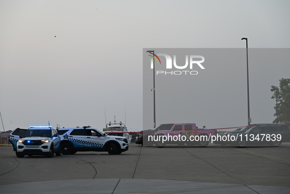 Chicago police are investigating the crime scene, which is leaving two people dead at 31st Street Harbor in Chicago, Illinois, on June 21, 2...