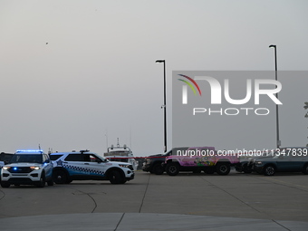 Chicago police are investigating the crime scene, which is leaving two people dead at 31st Street Harbor in Chicago, Illinois, on June 21, 2...