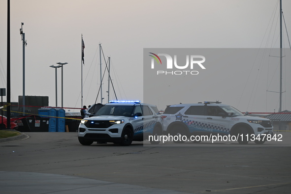 Chicago police are investigating the crime scene, which is leaving two people dead at 31st Street Harbor in Chicago, Illinois, on June 21, 2...