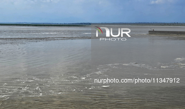 The river water of Teesta is flowing with an increased water level due to heavy rainfall in Jalpaiguri, Sikkim, on June 21, 2024, some 75 km...