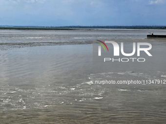 The river water of Teesta is flowing with an increased water level due to heavy rainfall in Jalpaiguri, Sikkim, on June 21, 2024, some 75 km...