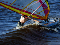 A windsurfer is struggling with the board and sail on the Kremenchuk Reservoir in Cherkasy, Ukraine, on June 20, 2024. NO USE RUSSIA. NO USE...