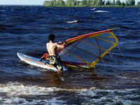 A man is practicing windsurfing on the Kremenchuk Reservoir in Cherkasy, Ukraine, on June 20, 2024. NO USE RUSSIA. NO USE BELARUS. (