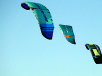 Three power kites are flying in the sky in Cherkasy, Ukraine, on June 20, 2024. (