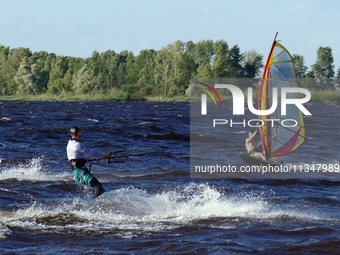 People are practicing kiteboarding and windsurfing on the Kremenchuk Reservoir in Cherkasy, Ukraine, on June 20, 2024. NO USE RUSSIA. NO USE...