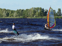 People are practicing kiteboarding and windsurfing on the Kremenchuk Reservoir in Cherkasy, Ukraine, on June 20, 2024. NO USE RUSSIA. NO USE...