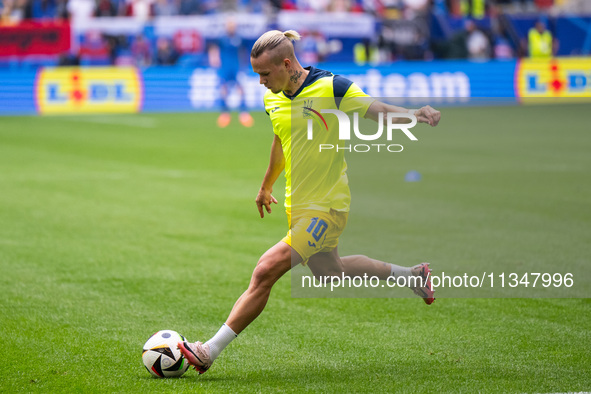 The players of Ukraine are walking onto the pitch  during the UEFA EURO 2024 group stage match between Slovakia and Ukraine at Düsseldorf Ar...