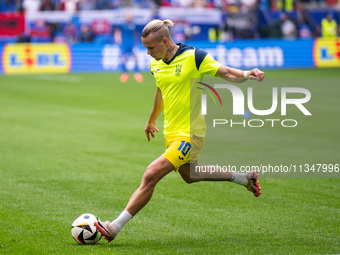 The players of Ukraine are walking onto the pitch  during the UEFA EURO 2024 group stage match between Slovakia and Ukraine at Düsseldorf Ar...