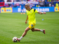 The players of Ukraine are walking onto the pitch  during the UEFA EURO 2024 group stage match between Slovakia and Ukraine at Düsseldorf Ar...