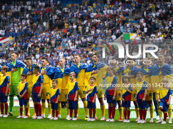 The players of Ukraine are singing the national anthem  during the UEFA EURO 2024 group stage match between Slovakia and Ukraine at Düsseldo...