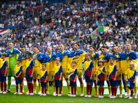 The players of Ukraine are singing the national anthem  during the UEFA EURO 2024 group stage match between Slovakia and Ukraine at Düsseldo...