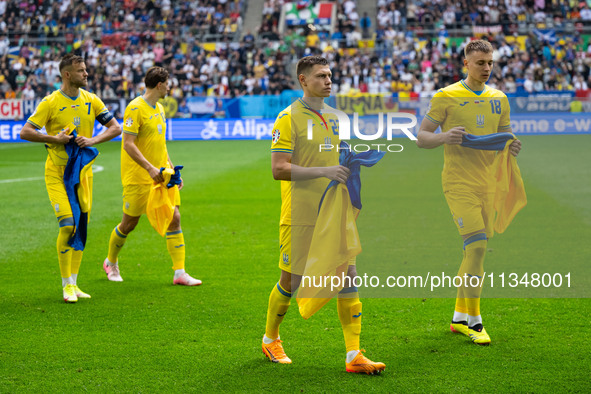 Mykola Matvienko and Volodymyr Brazhko of Ukraine are standing prior to the match  during the UEFA EURO 2024 group stage match between Slova...