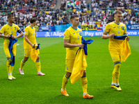 Mykola Matvienko and Volodymyr Brazhko of Ukraine are standing prior to the match  during the UEFA EURO 2024 group stage match between Slova...