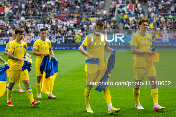 Mykola Shaparenko, Georgiy Sudakov, Andriy Yarmolenko, and Ilya Zabarnyi of Ukraine are standing prior to the match  during the UEFA EURO 20...