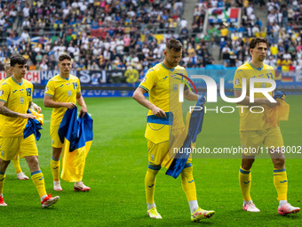 Mykola Shaparenko, Georgiy Sudakov, Andriy Yarmolenko, and Ilya Zabarnyi of Ukraine are standing prior to the match  during the UEFA EURO 20...