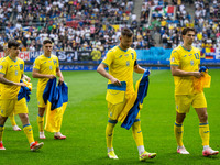 Mykola Shaparenko, Georgiy Sudakov, Andriy Yarmolenko, and Ilya Zabarnyi of Ukraine are standing prior to the match  during the UEFA EURO 20...