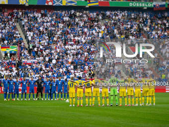 Players of Slovakia and Ukraine are taking part in a minute of silence  during the UEFA EURO 2024 group stage match between Slovakia and Ukr...