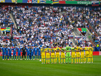 Players of Slovakia and Ukraine are taking part in a minute of silence  during the UEFA EURO 2024 group stage match between Slovakia and Ukr...