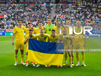 The players of Ukraine are posing for a team photo  during the UEFA EURO 2024 group stage match between Slovakia and Ukraine at Düsseldorf A...