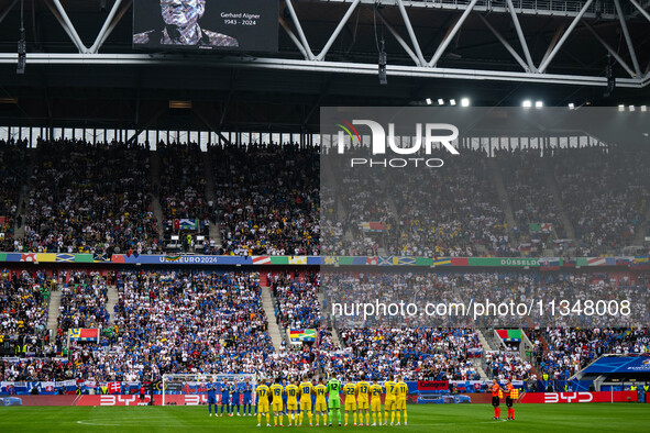 Players of Slovakia and Ukraine are taking part in a minute of silence  during the UEFA EURO 2024 group stage match between Slovakia and Ukr...