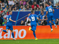 Ivan Schranz of Slovakia is celebrating after scoring his team's first goal with Juraj Kucka and Robert Bozenik of Slovakia  during the UEFA...