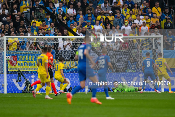 Anatoliy Trubin of Ukraine is not preventing Slovakia's first goal  during the UEFA EURO 2024 group stage match between Slovakia and Ukraine...