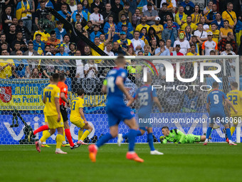 Anatoliy Trubin of Ukraine is not preventing Slovakia's first goal  during the UEFA EURO 2024 group stage match between Slovakia and Ukraine...