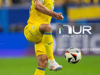 Oleksandr Tymchyk of Ukraine is controlling the ball  during the UEFA EURO 2024 group stage match between Slovakia and Ukraine at Düsseldorf...