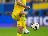 Oleksandr Tymchyk of Ukraine is controlling the ball  during the UEFA EURO 2024 group stage match between Slovakia and Ukraine at Düsseldorf...