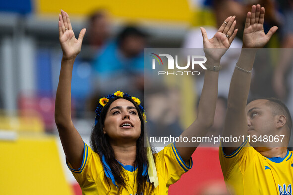 A fan of Ukraine is preparing for the match  during the UEFA EURO 2024 group stage match between Slovakia and Ukraine at Düsseldorf Arena on...