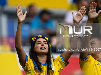 A fan of Ukraine is preparing for the match  during the UEFA EURO 2024 group stage match between Slovakia and Ukraine at Düsseldorf Arena on...