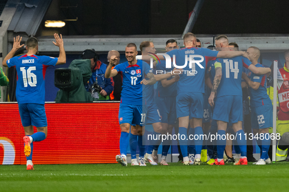 Ivan Schranz of Slovakia is celebrating with his teammates after scoring his team's first goal  during the UEFA EURO 2024 group stage match...