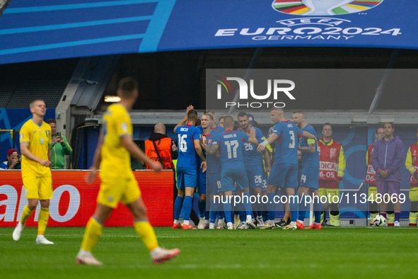 Ivan Schranz of Slovakia is celebrating with his teammates after scoring his team's first goal  during the UEFA EURO 2024 group stage match...