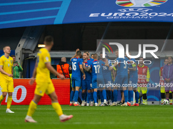 Ivan Schranz of Slovakia is celebrating with his teammates after scoring his team's first goal  during the UEFA EURO 2024 group stage match...