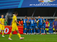 Ivan Schranz of Slovakia is celebrating with his teammates after scoring his team's first goal  during the UEFA EURO 2024 group stage match...