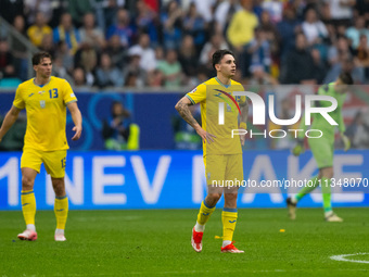 Mykola Shaparenko is looking dejected after Slovakia's first goal  during the UEFA EURO 2024 group stage match between Slovakia and Ukraine...