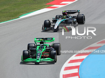 Guanyu Zhou, from Stake F1 Team Kick Sauber, is driving a Kick Sauber C44, and Lewis Hamilton, from Mercedes-AMG PETRONAS Formula One Team,...