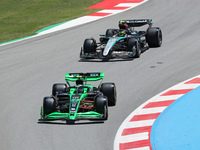 Guanyu Zhou, from Stake F1 Team Kick Sauber, is driving a Kick Sauber C44, and Lewis Hamilton, from Mercedes-AMG PETRONAS Formula One Team,...