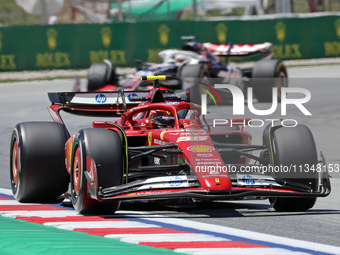 Carlos Sainz, from Scuderia Ferrari HP, is driving a Ferrari SF24 during practice 1 of the Formula 1 Aramco Spanish Grand Prix, held at the...